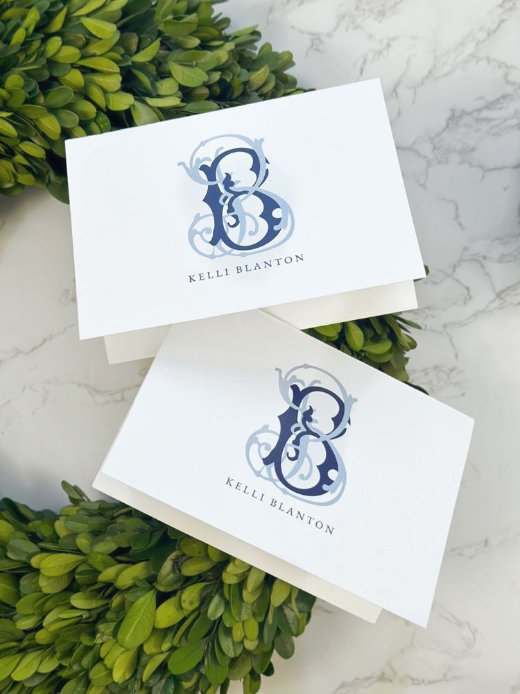 Personalized blue monogram stationery with greenery
