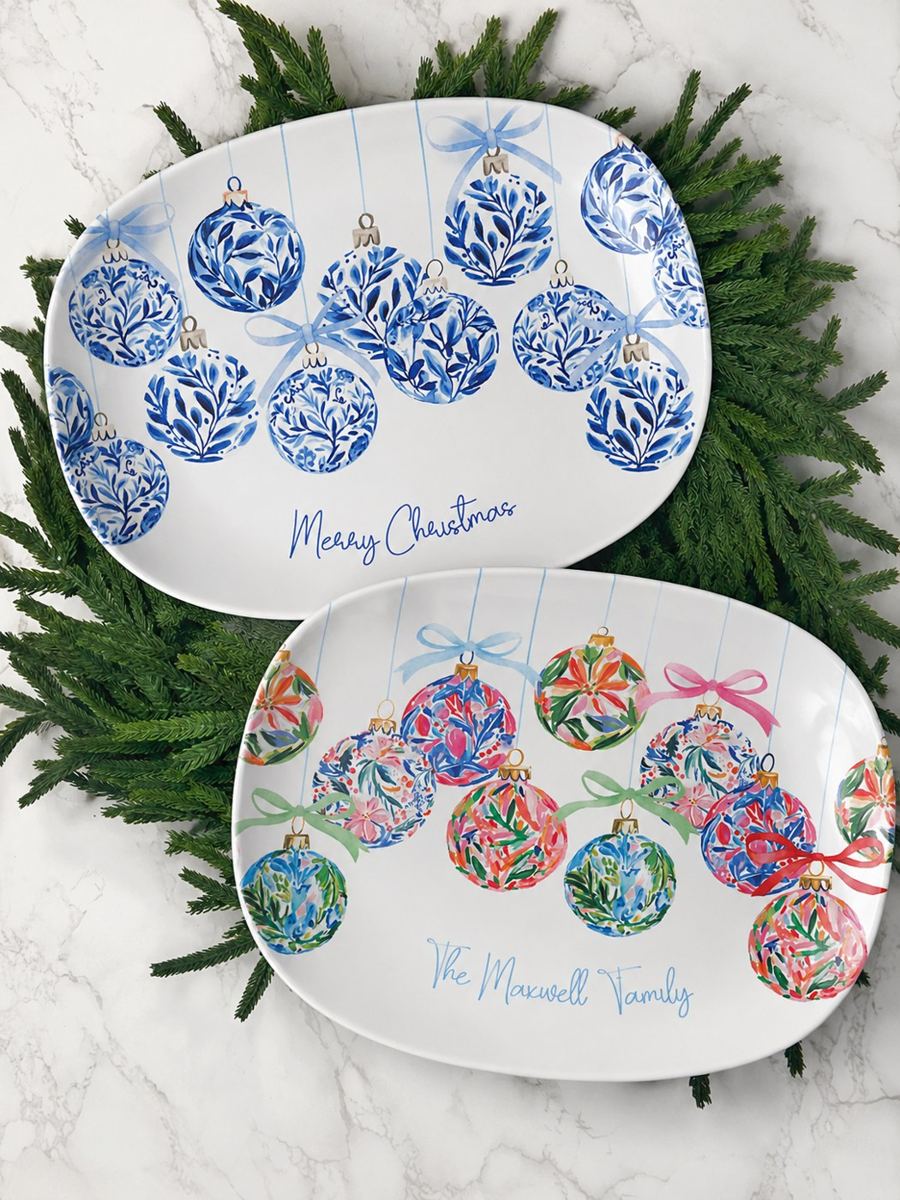 Blue and colorful Boca Baubles Christmas platters on greenery