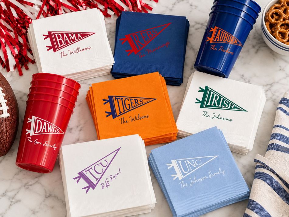 Personalized collegiate cups and cocktail napkins in team colors